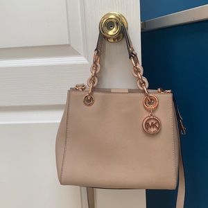 Michael Kors light pink bag& 8 inches high. 10 inches wide